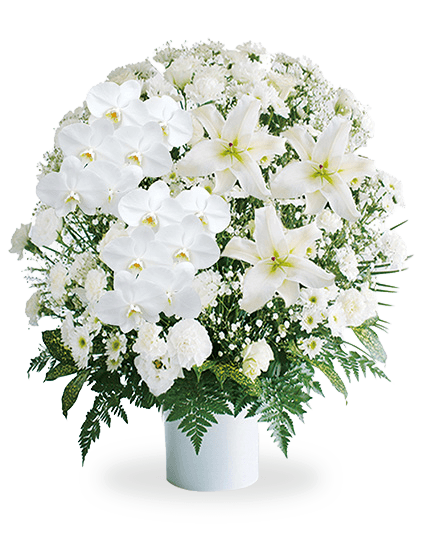 白いユリを中心に淡い紫とピンクの花を添えた葬儀用生花